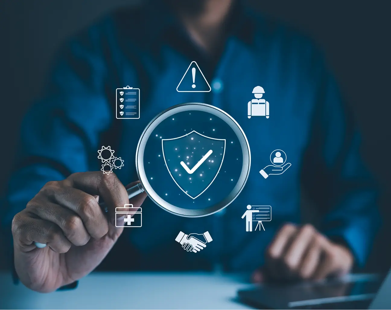 Magnifying glass over digital security icons